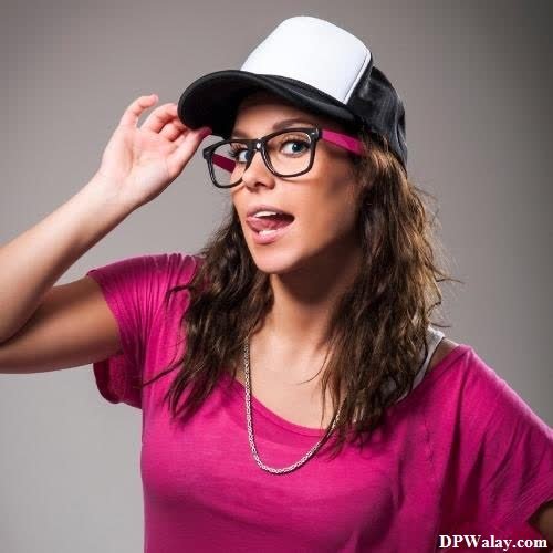 a woman wearing glasses and a hat
