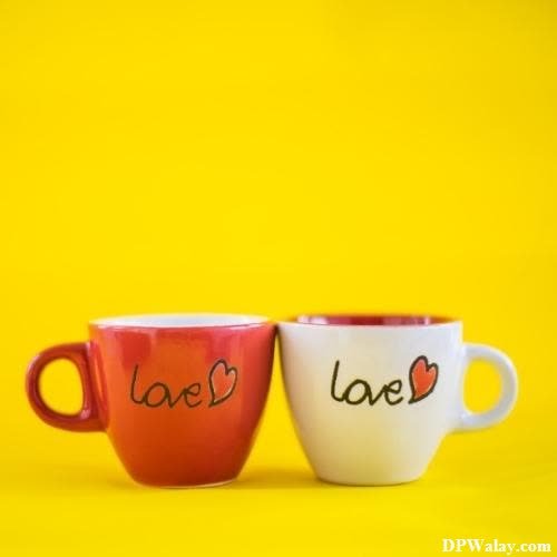 two cups with the words love written on them