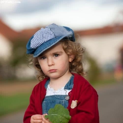 a little girl in a red jacket and blue hat cute girl baby pic for dp
