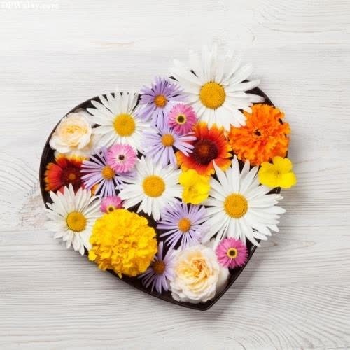 a heart shaped chocolate with flowers on it