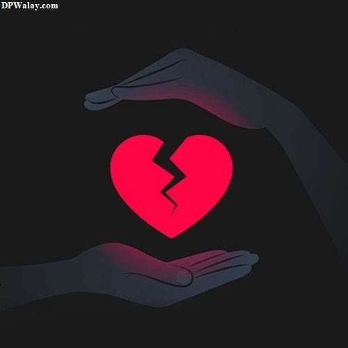 a broken heart in the hands of someone
