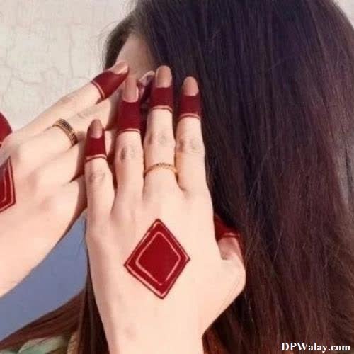 girls dp - a woman with long hair and red nails