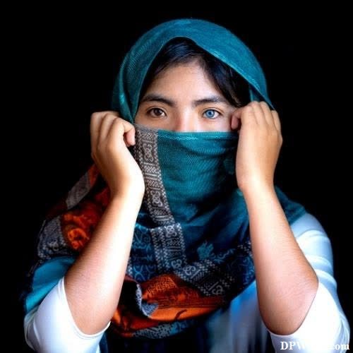 a woman wearing a scarf and a blue scarf