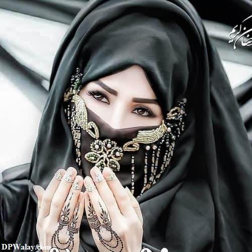 a woman in a black hina with a gold and silver necklace girl images dp 