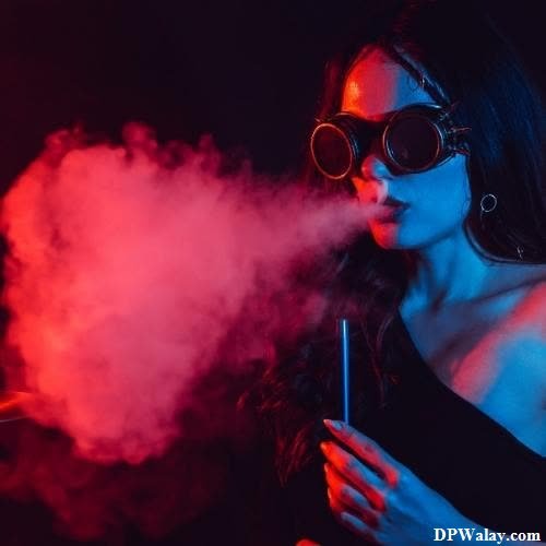 a woman in sunglasses smoking a cigarette
