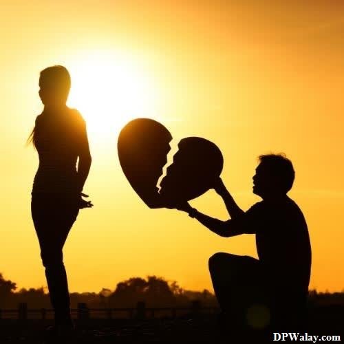 silhouette of a man and woman holding balloons