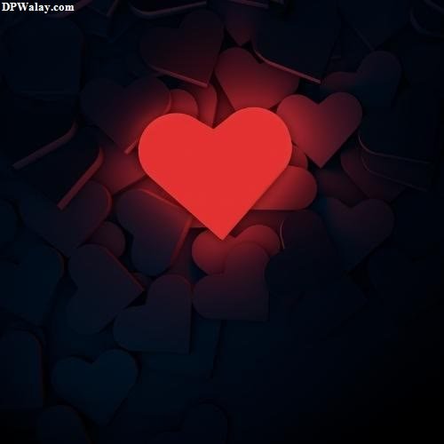 a heart in the middle of a dark background 