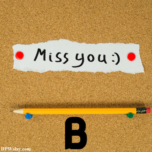 a pencil and a piece of paper with the word miss you