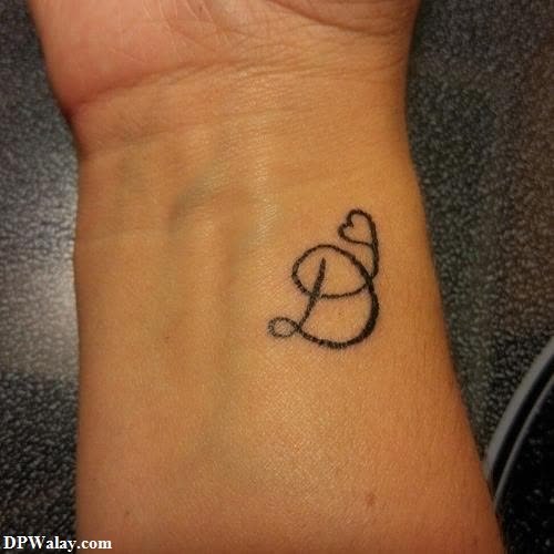 a small tattoo on the wrist