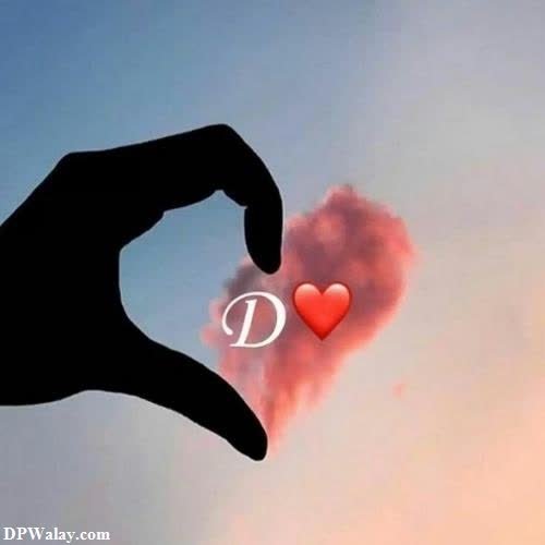 a hand holding a heart with the word i love you d whatsapp dp 