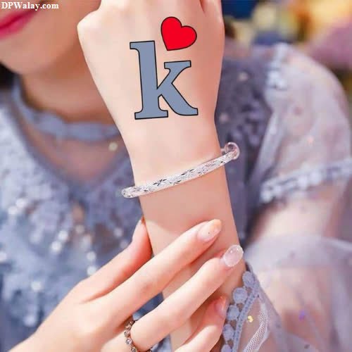 K Name DP - a woman with a wrist tattoo that says i love k