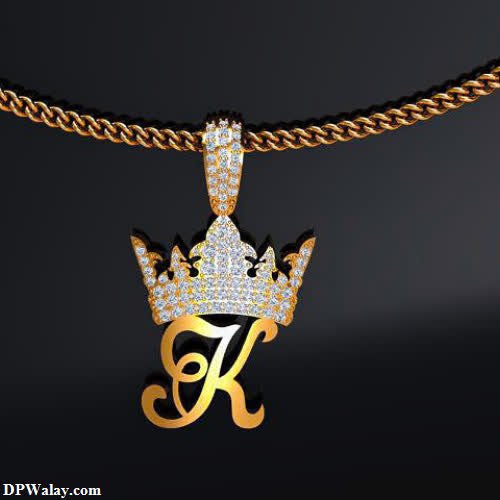 a gold chain with a crown pendant on it love k name dp 