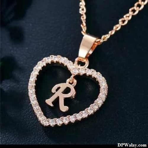 a heart shaped pendant with a diamond heart