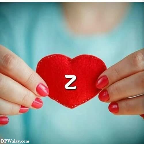 a woman holding a red heart with the number 2 on it 