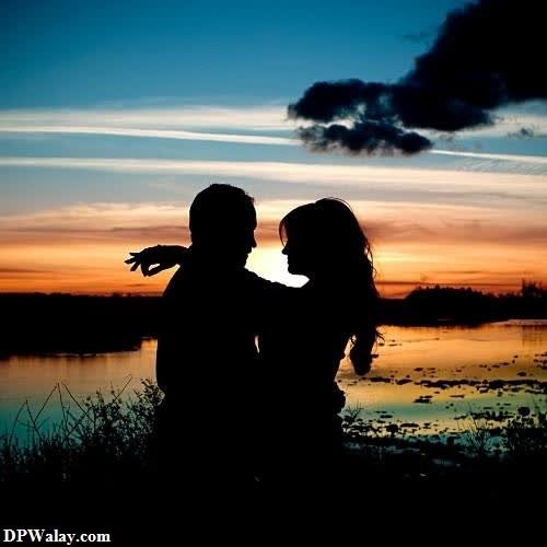 a couple is silhouetted against a sunset caring couple dp